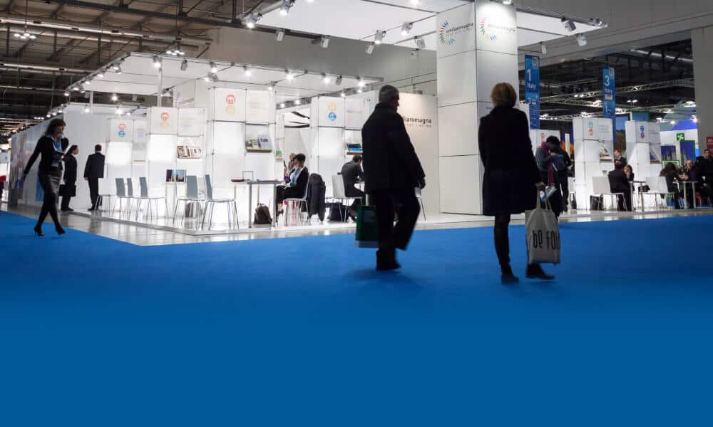 This images shows attendees engaging in a trade show booth